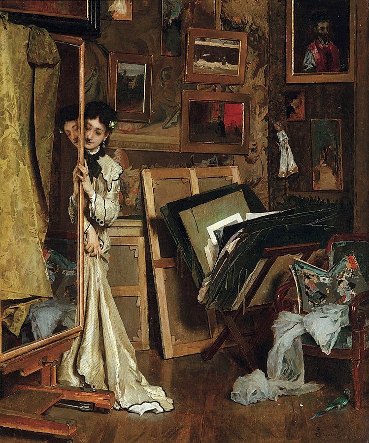 painting of an artist's model leaning on a mirror, surrounded by messy stacks of canvas and hagning paintings